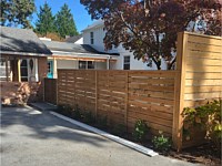 <b>6 foot and 8 foot high horizontal cedar board fence</b>